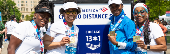 Finishers displaying their medals after the 2025 Bank of America Chicago 13.1
